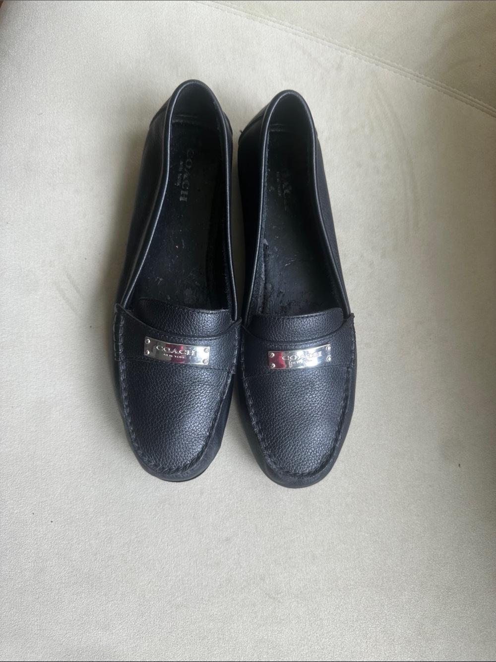 Coach Black Pebbled Leather Slip-On Loafers with Silver Plaque